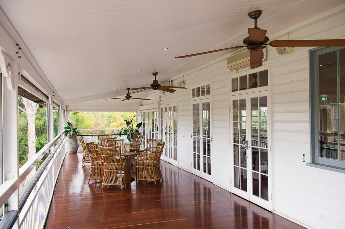 Chairs set up on the veranda outside the Rosewood Room at Hillstone St Lucia, Brisbane.