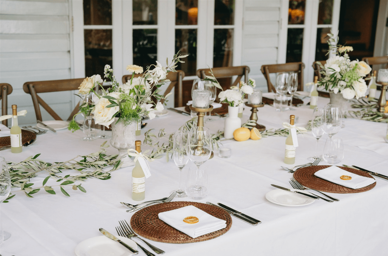Citrus and floral-themed wedding reception table at Hillstone St Lucia, Brisbane.