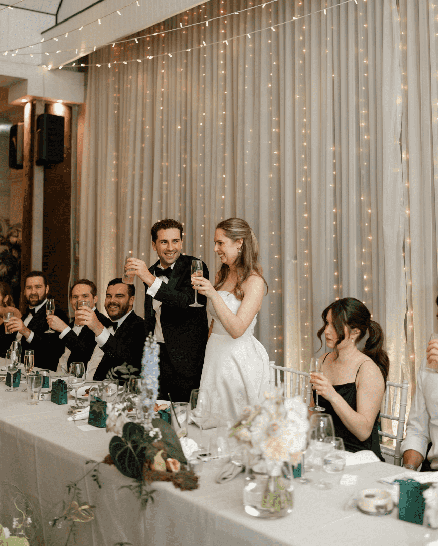 Bridal table with flowers and fairy lights at a wedding reception venue in Brisbane