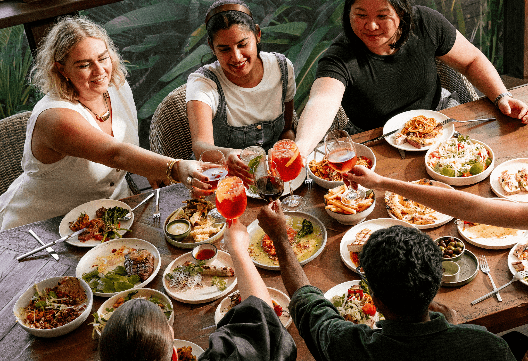 People gathering around a table for an event at Hundred Acre Bar in Brisbane.