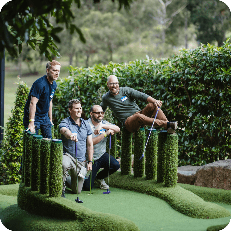Group of men posing for a photo at a team building event in Brisbane