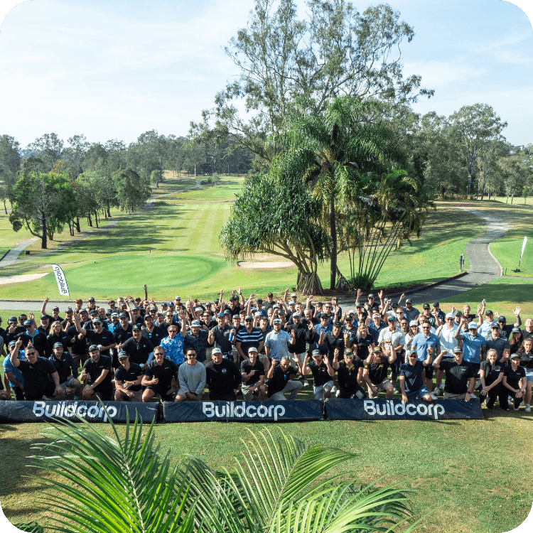 A company team group photo at golf course in Brisbane