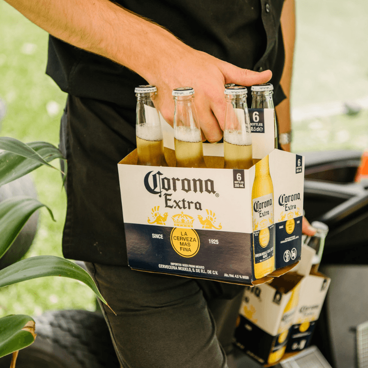 Person carrying Corona beers at St Lucia Golf Links