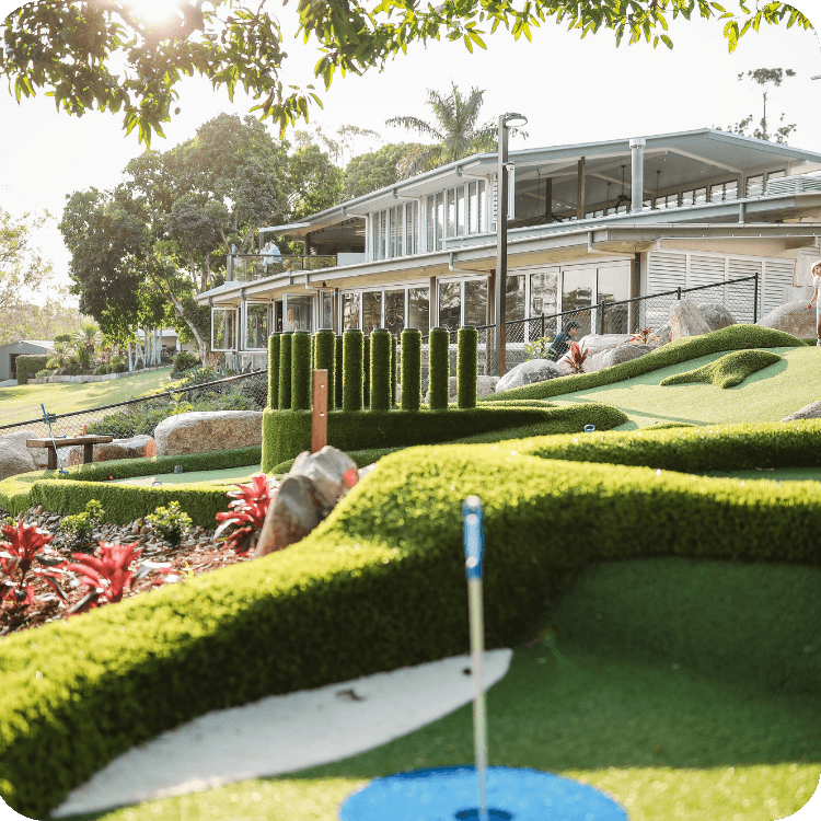 Outdoor mini golf course in Brisbane with restaurant in the background